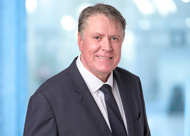 Luke Mackintosh smiling at the camera.