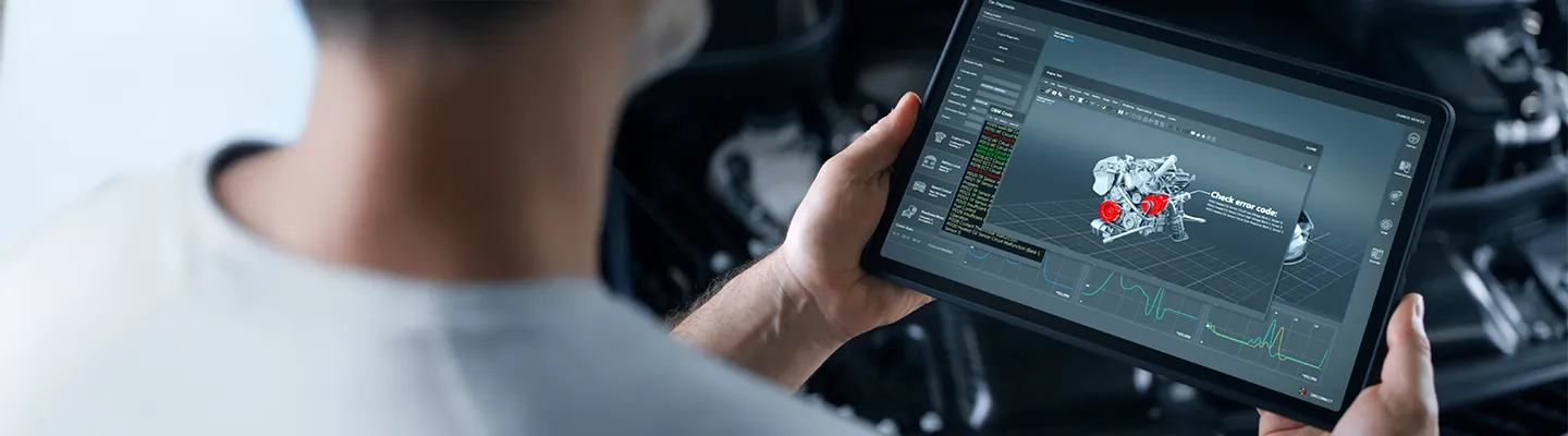 A car repairman performs wireless diagnostics of a car, scanning for errors and searching for breakdowns.