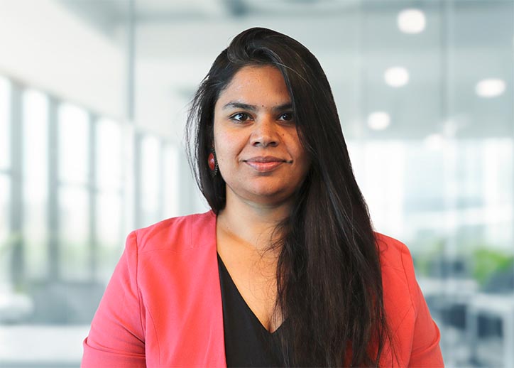 Sigra Sharma, Consulting, smiling at the camera.