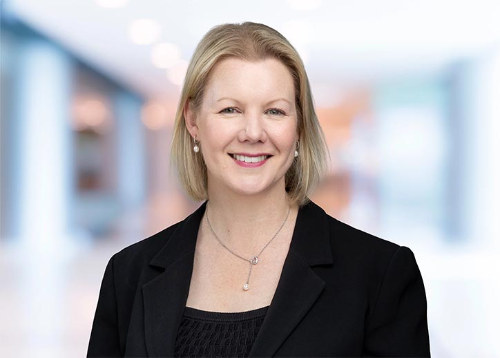 Sally Whenman smiling at the camera.