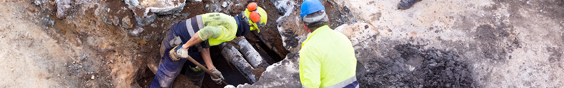 Men working on fixing utilities